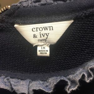 Jeweled crown and ivy sweater.